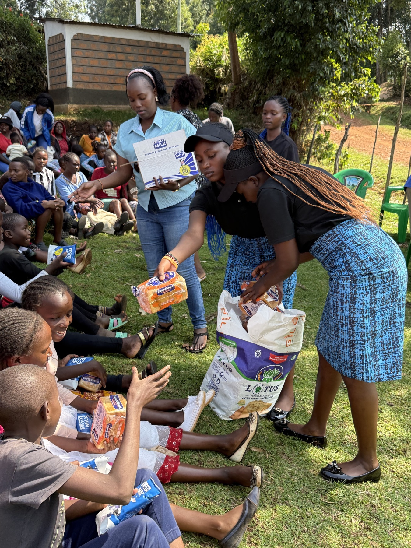 Community team members distributing food supplies to families