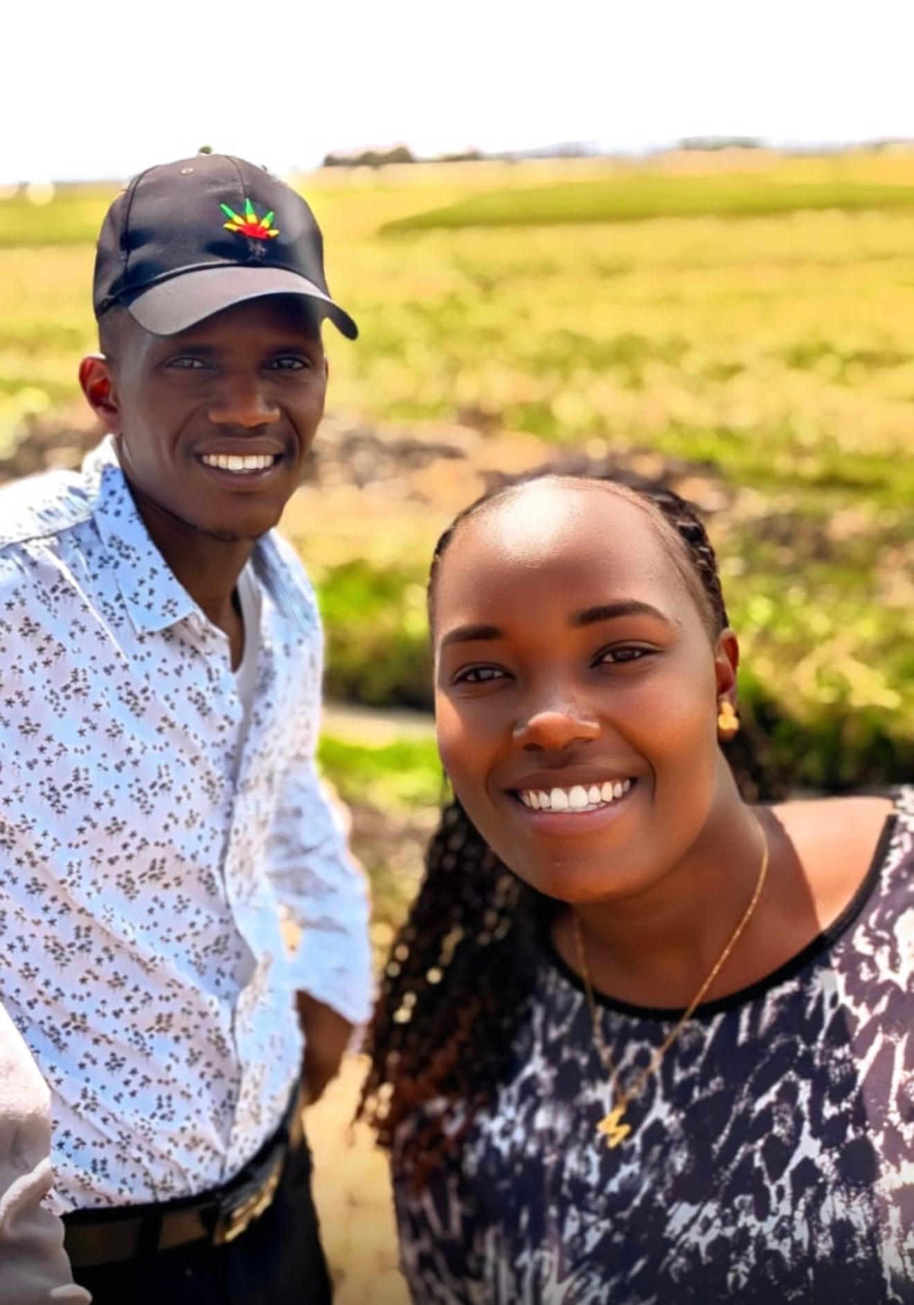 Mercy and David, Community Support Coordinators, smiling outdoors